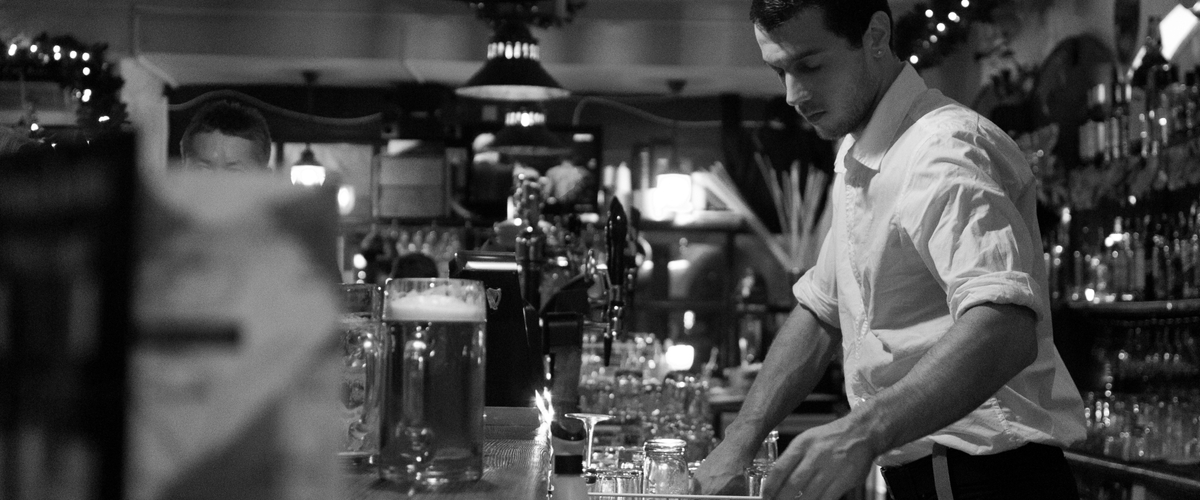 Bartender cleaning up